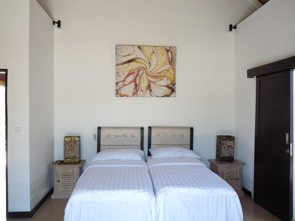 Taman Dewi Sri Villa et Bungalow Pemuteran Zimmer foto